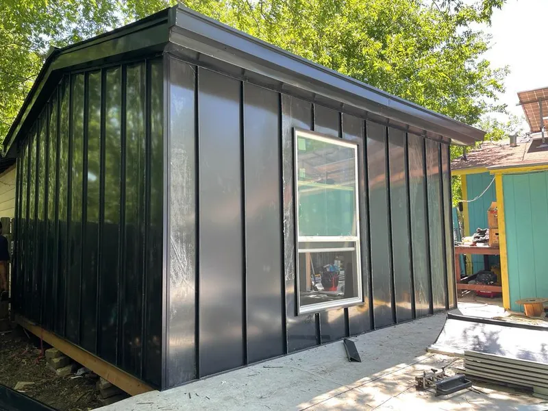 Black standing seam metal wall panels for Roof Inspection in Bonadelle Ranchos