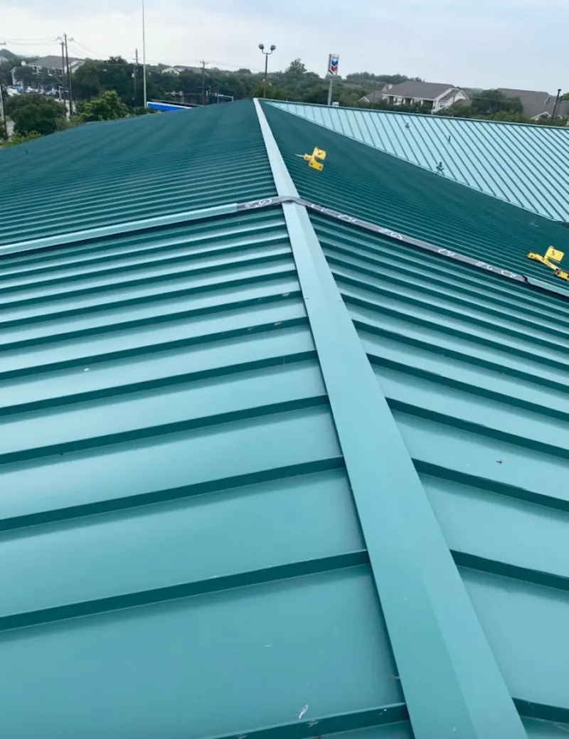 Green commercial metal roof ridge and valley for Metal Roof Repair in Bonadelle Ranchos